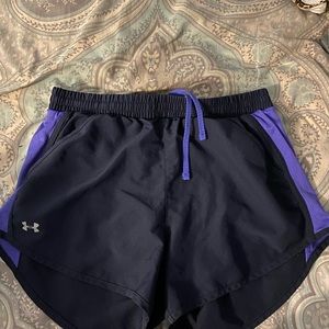 Navy blue and purple under armour running shorts
